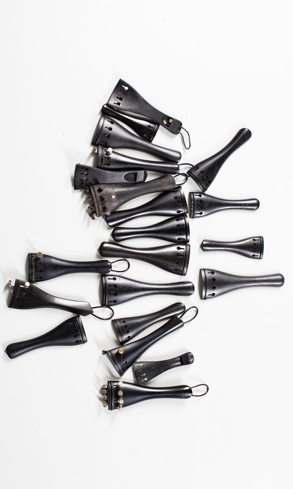 Twenty-one ebony tailpieces, various sizes