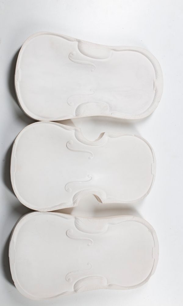 Three plaster moulds of violin fronts, including one of the San Lorenzo Stradivarius, 1718