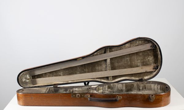 A wooden W. E. Hill & Sons violin case
