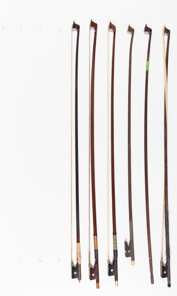 Five violin bows and one violin bow stick, various sizes