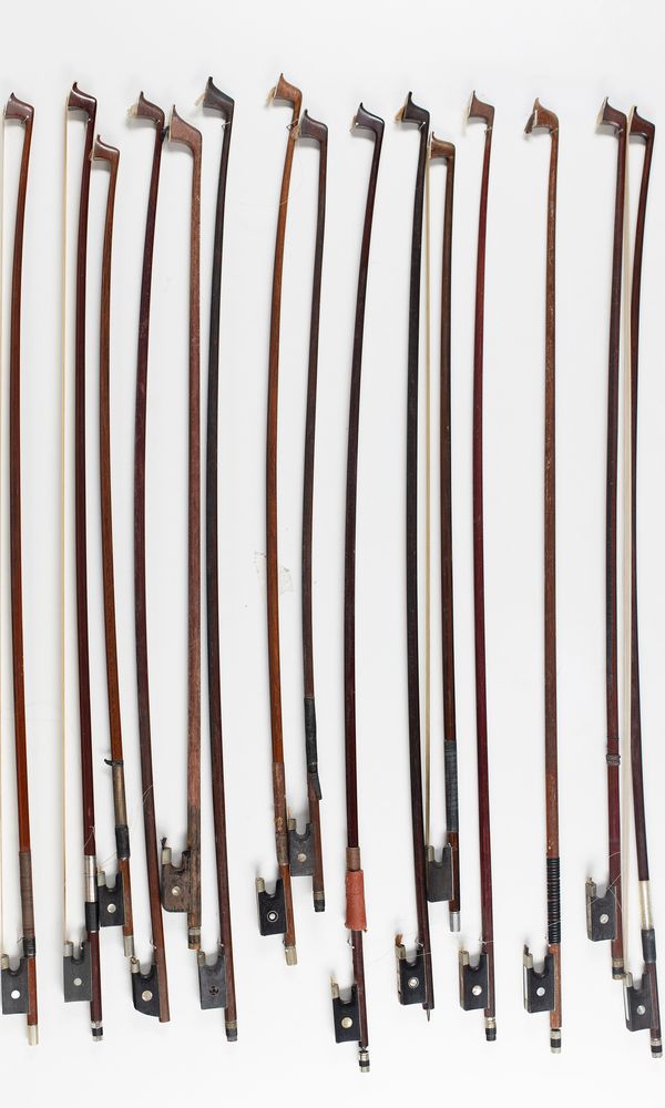 Nine violin bows and six child's violin bows