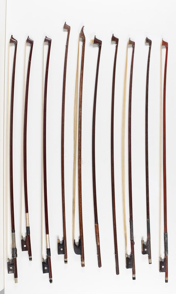 Eight violin bows and two bow sticks, varying lengths