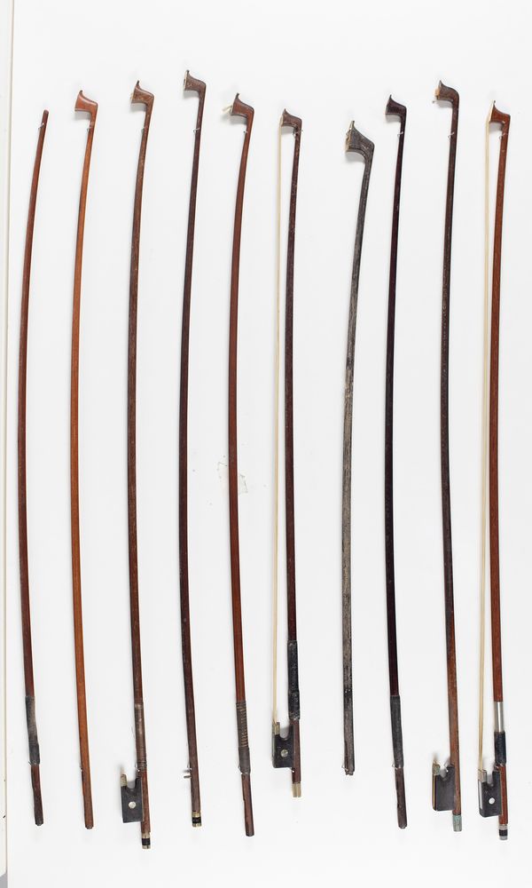 Four violin bows and six bow sticks, varying lengths