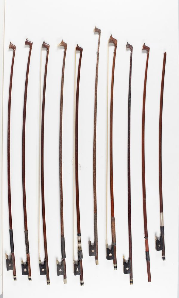 Eight violin bows, one cello bow and a bow stick, varying lengths