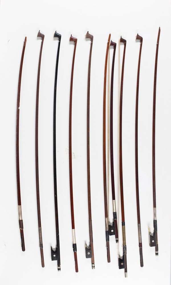 Five violin bows and five bow sticks, varying lengths