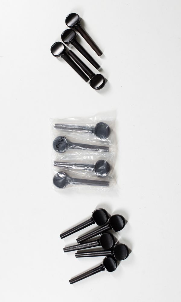Three sets of half size cello pegs