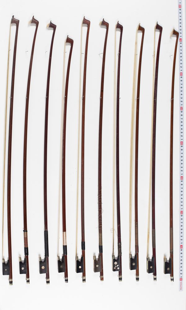 Eleven violin bows, varying lengths