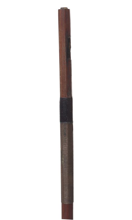 An unmounted violin bow, branded Tourte