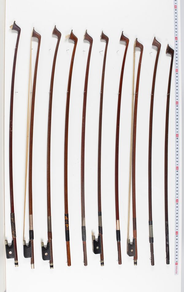 Five cello bows and five cello sticks, varying lengths