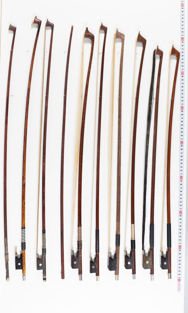 Seven violin bows, ten cello bows and six bow sticks, varying lengths