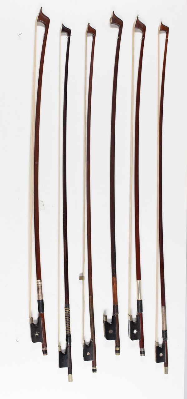 Three violin bows and three bow sticks, varying lengths