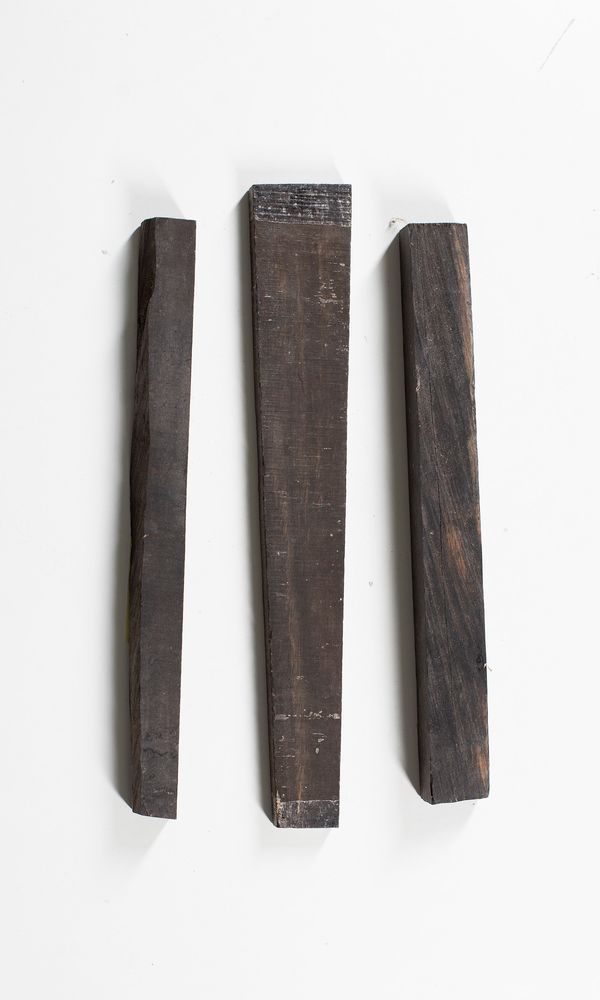 One ebony fingerboard blank and two ebony pieces for endnuts or saddles