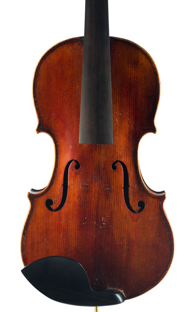 A violin, labelled Medio Fino