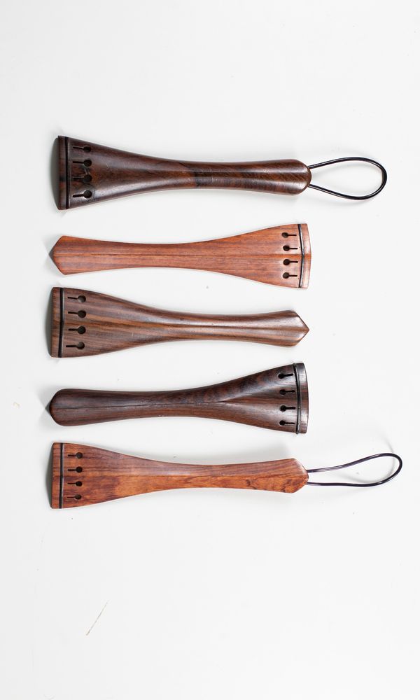 Five cello tailpieces