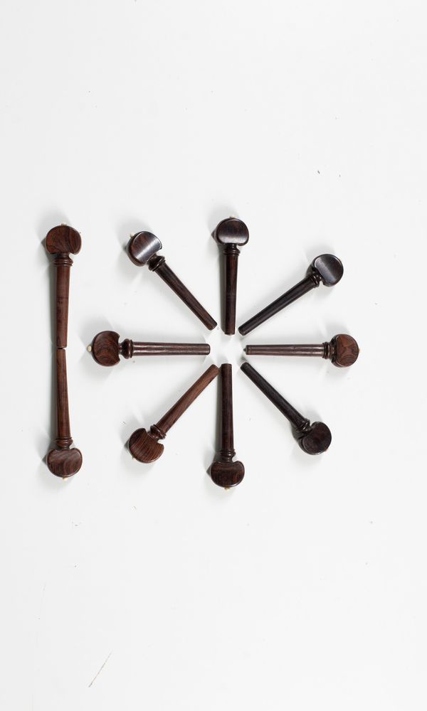 A set of ten viola da gamba pegs