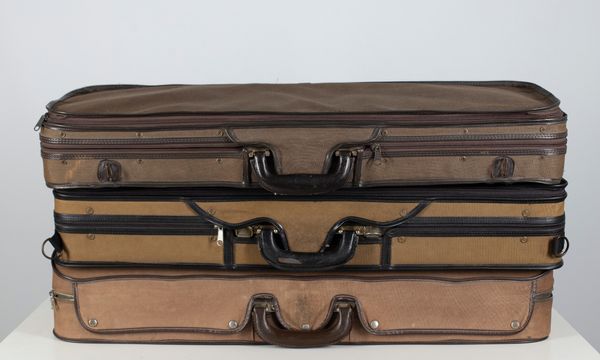 Three violin cases branded Gordge, Liebe and Meile