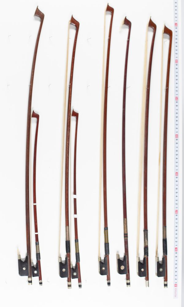 Two child violin bows and six cello bows, varying lengths