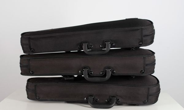 Three black half-size violin cases, branded Gewa