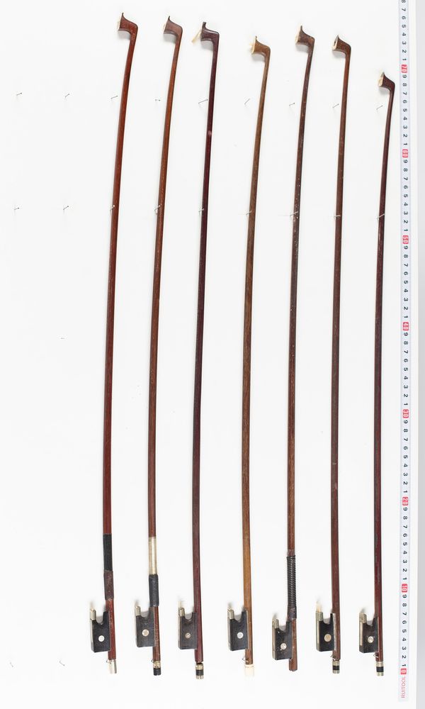 Seven violin bows, varying lengths