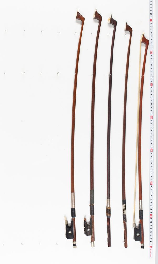 Two violin bows, three cello bows and two bow sticks, varying lengths