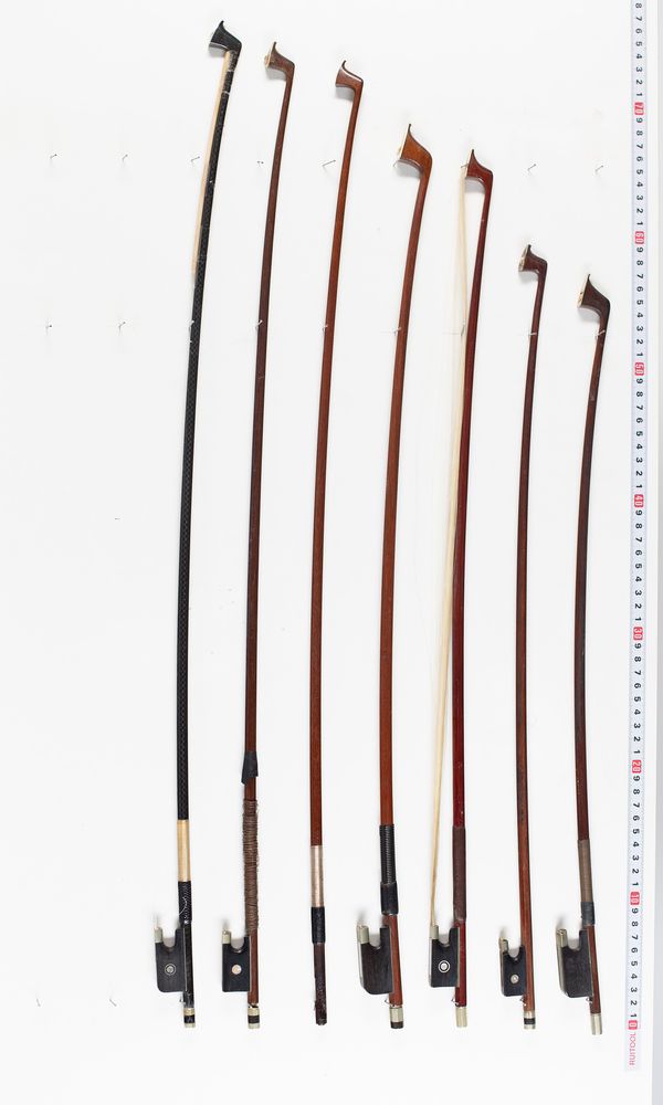 Three violin bows, two cello bows and one bow sticks, varying lengths