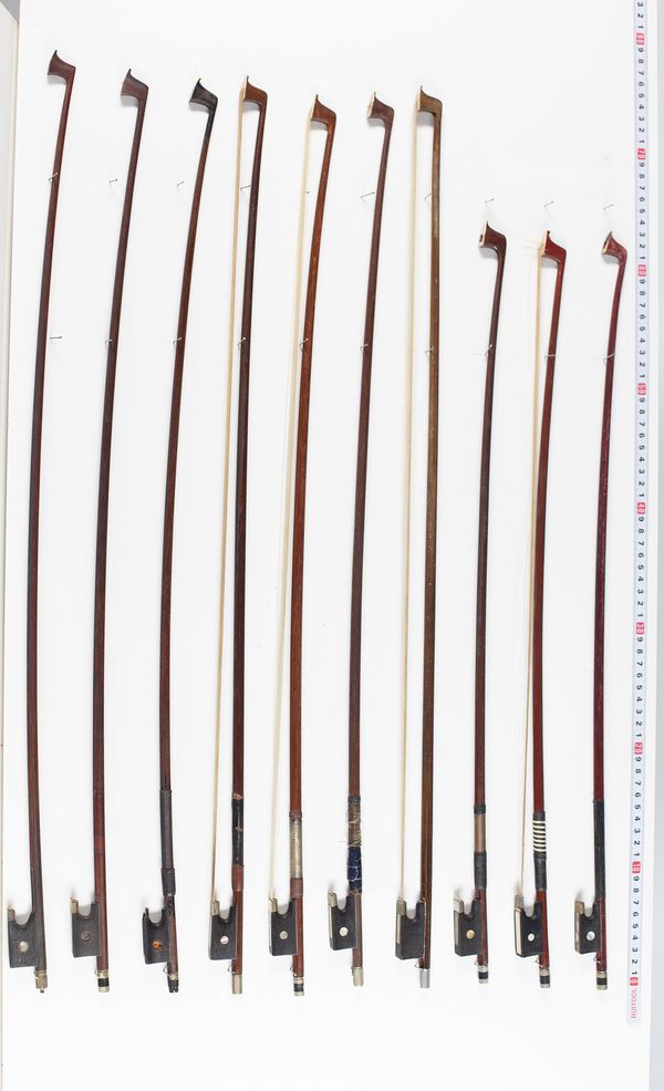 Eighteen violin bows and two bow sticks, varying lengths