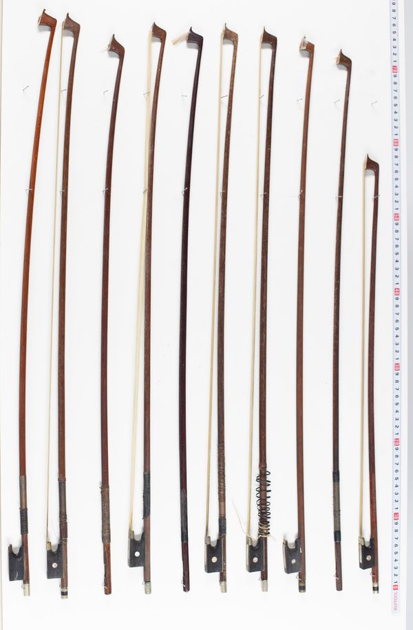 Twenty-two violin bows  and five bow sticks, varying lengths