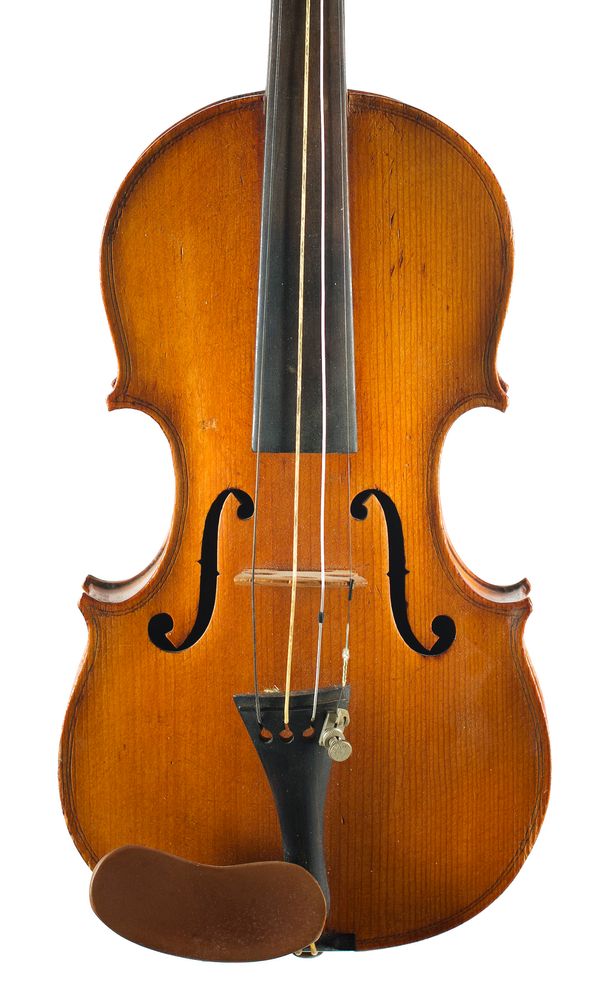 A half-sized violin, labelled Medio Fino