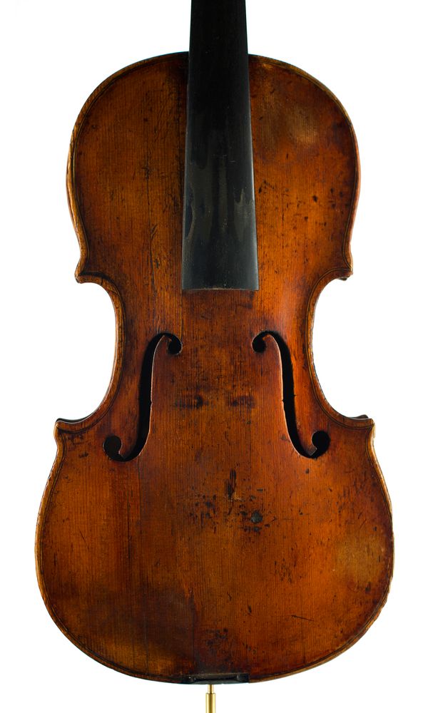 A violin, labelled Repaired by Hawkes & Son