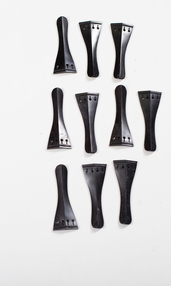 Eleven violin tailpieces, ebony