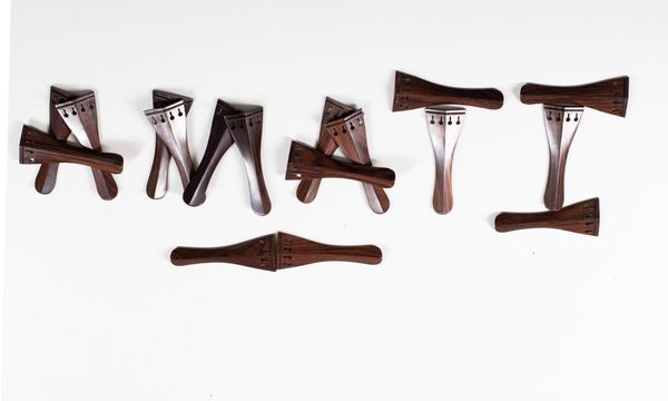 Seventeen violin tailpieces, rosewood