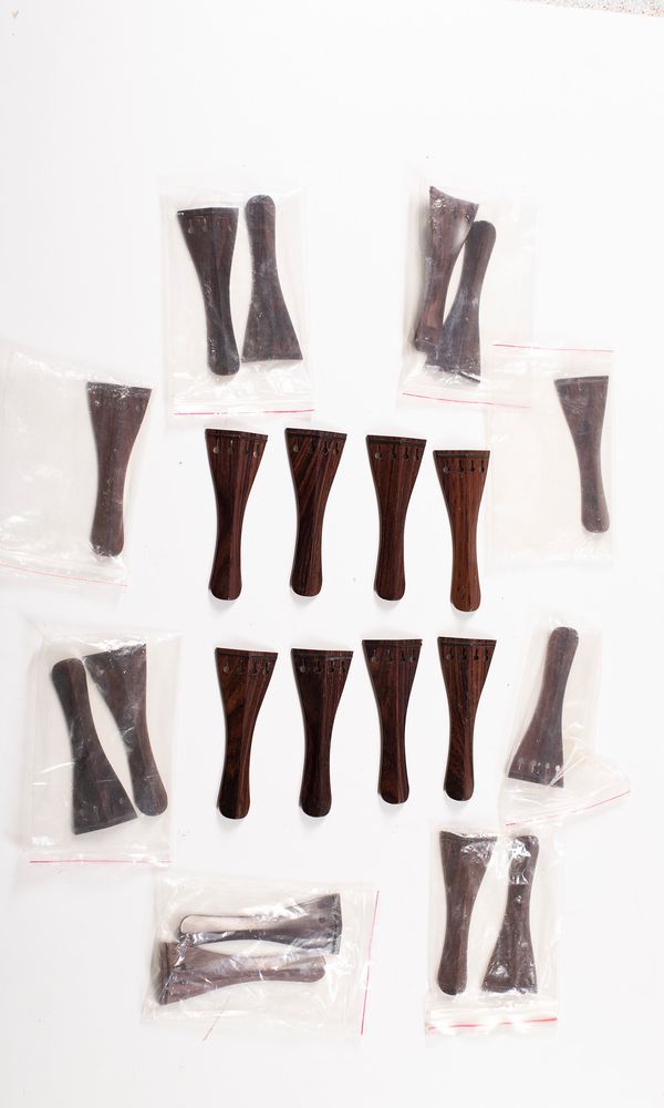 Twenty violin tailpieces, rosewood