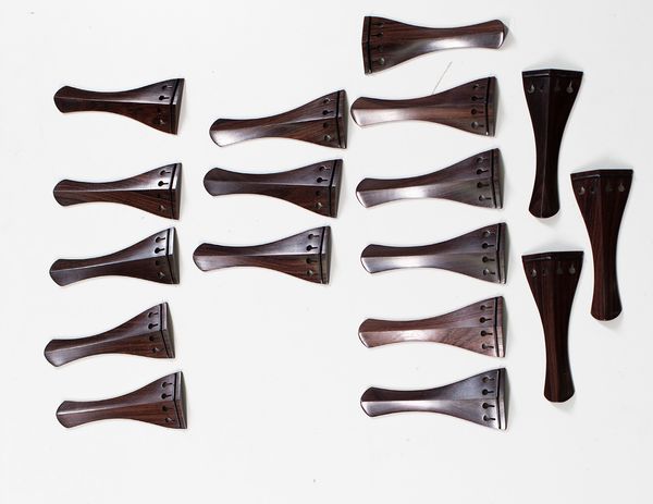 Seventeen violin tailpieces, rosewood