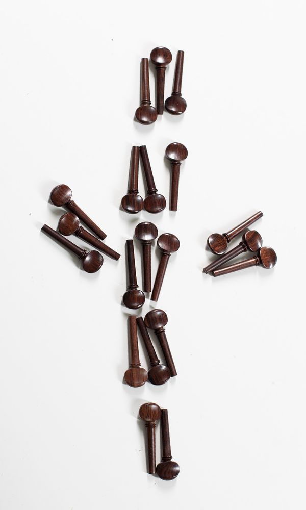 Twenty sets of four violin swiss-style pegs, rosewood