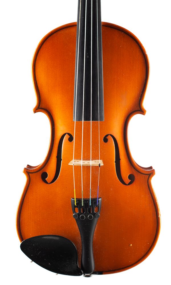 A three-quarter sized violin, labelled Made in the Workshops of Andreas Zeller