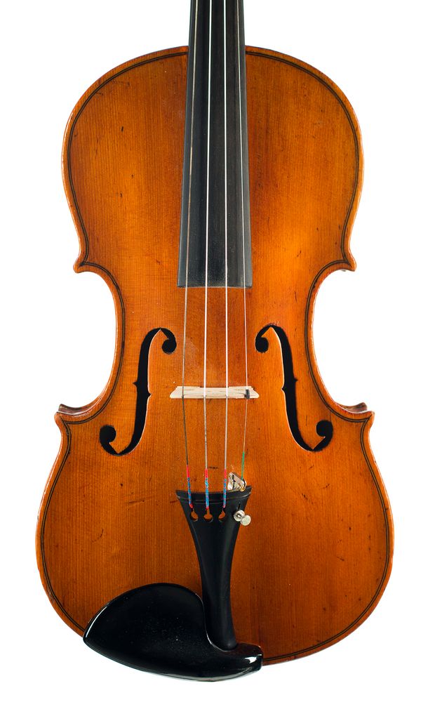 A violin, labelled Manufactured in Dresden