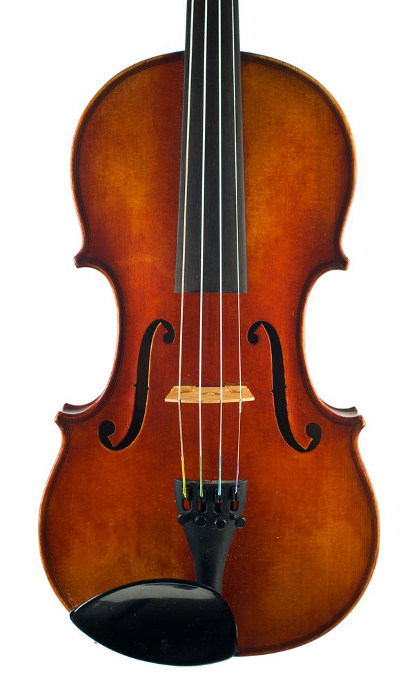 A violin, labelled Charles Bovis Over 100 years old