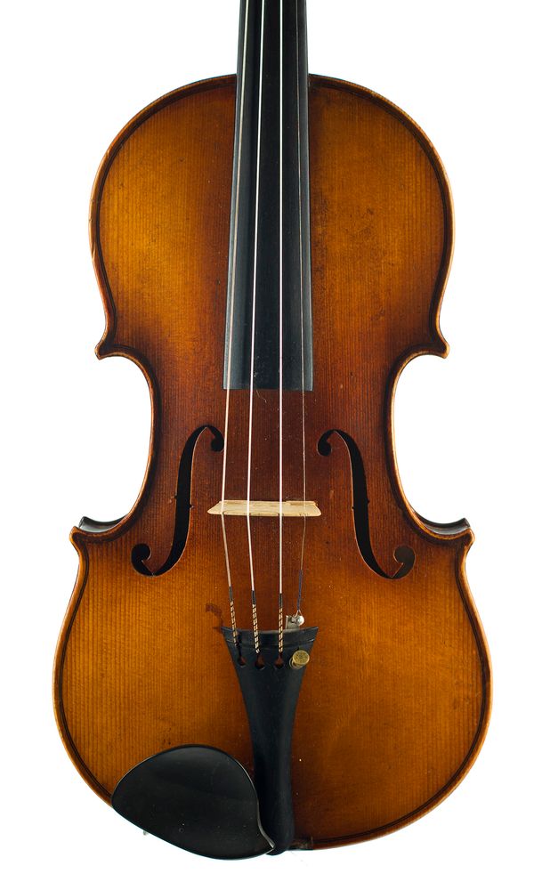 A violin, labelled Léon Mougenot-Gauche