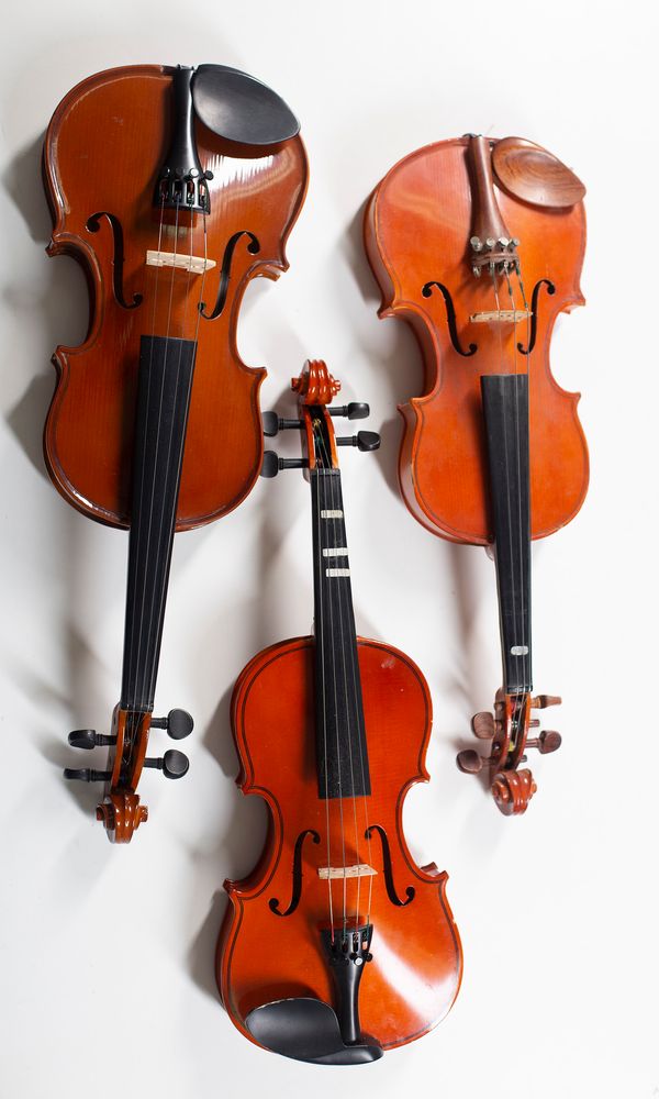 Three half size violin