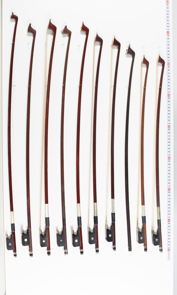 Fifteen cello bows and two sticks, varying lengths