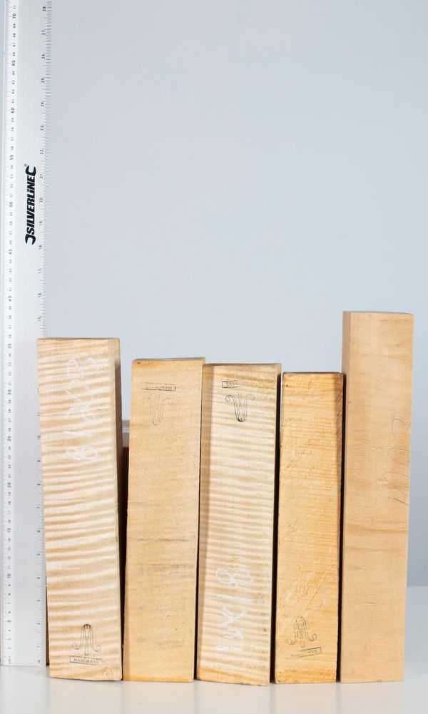 Five violin scroll blocks, maple