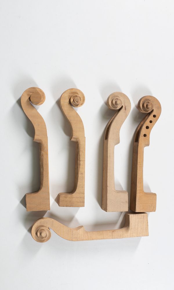 Five partially made violin scrolls