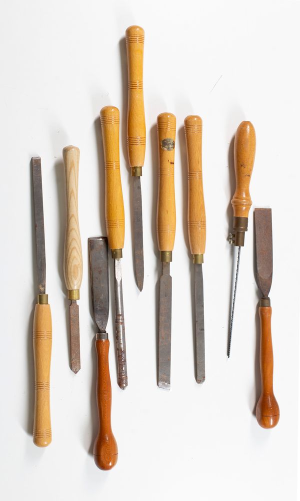 Eight chisels and one saw