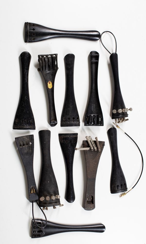 Thirty seven cello tailpieces, various sizes