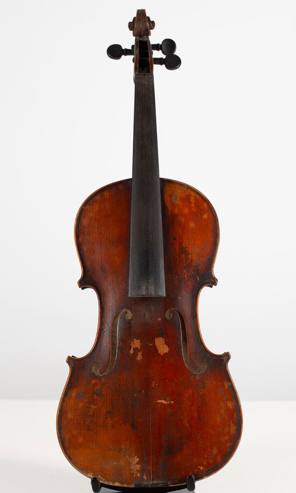 A partially made violin plus violin parts