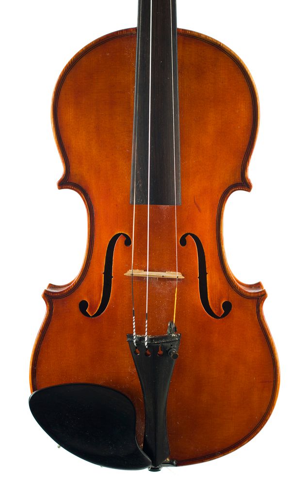 A violin, labelled Enzo Meucci