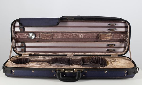 A violin case, branded Gewa