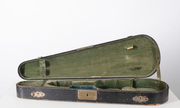 A violin case branded W. E. Hill & Sons