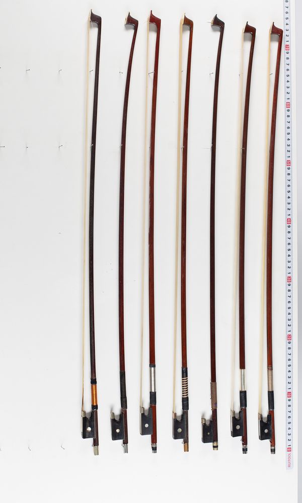 Eight violin bows, varying lengths
