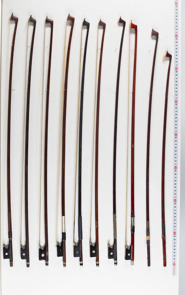 Eleven violin bows, varying sizes